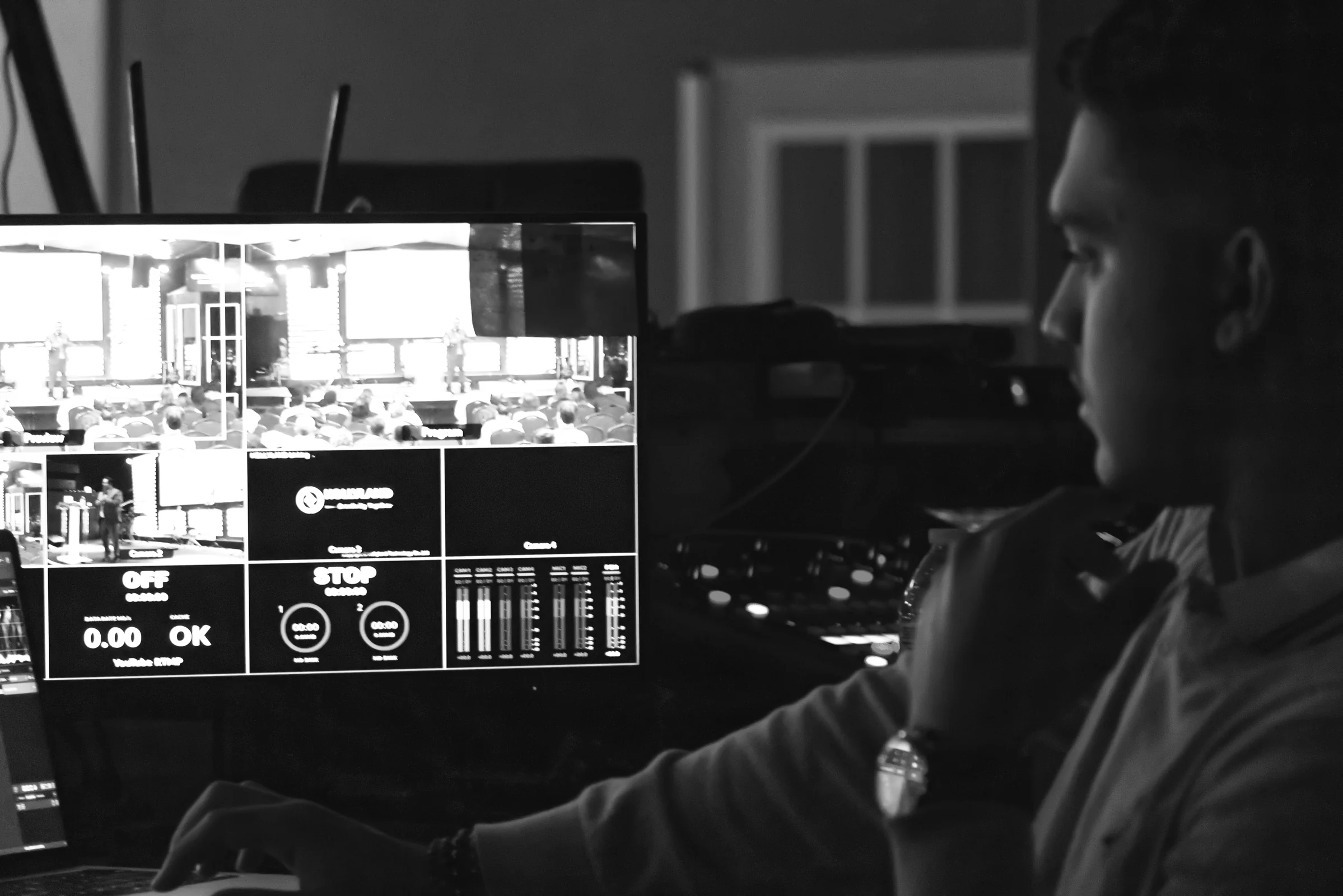 Kenny reviewing live production monitors during a church service